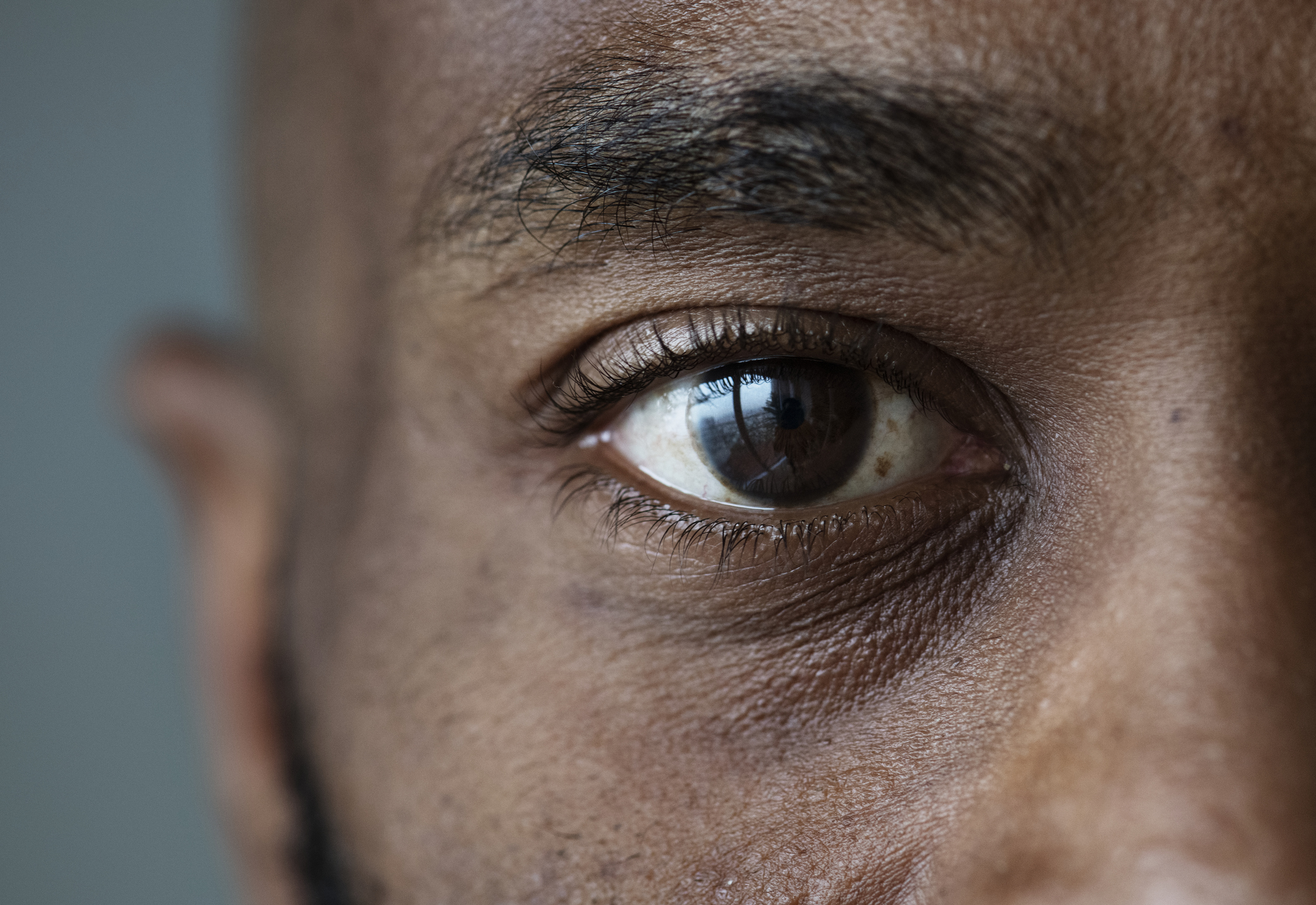 A close up of an eye on a man.