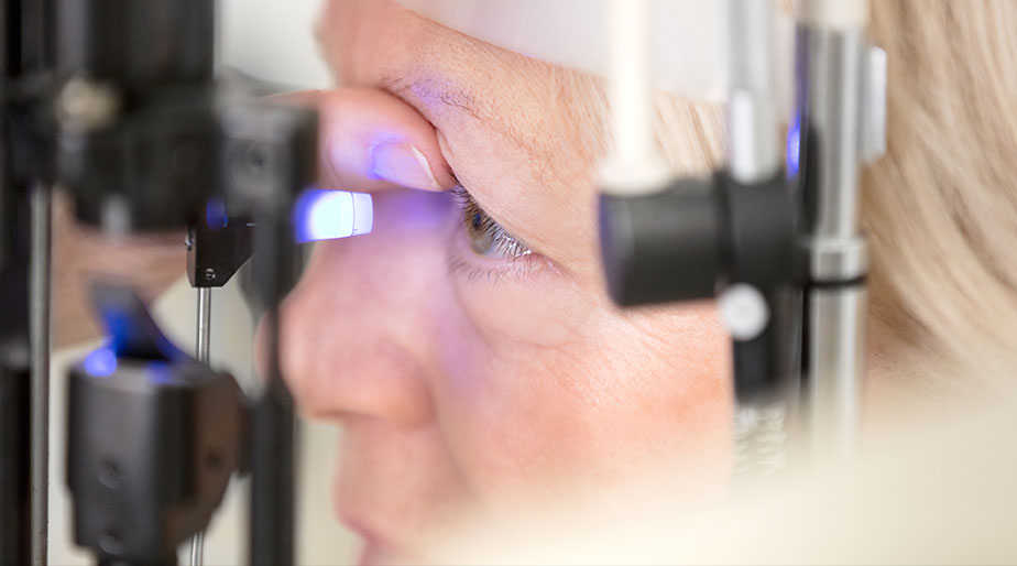 A closeup of a patient having their eye examined