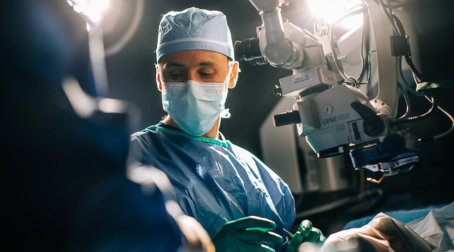 Dr. Griffeth during a procedure with a nurse and patient.