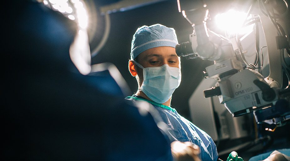 Dr. Mark Griffeth in a medical procedure with nurses and a patient.