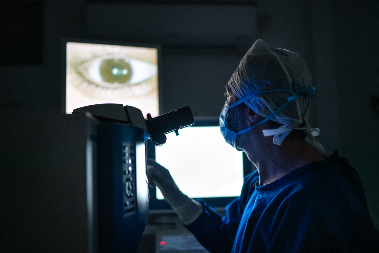 doctor looks at footage of an eye