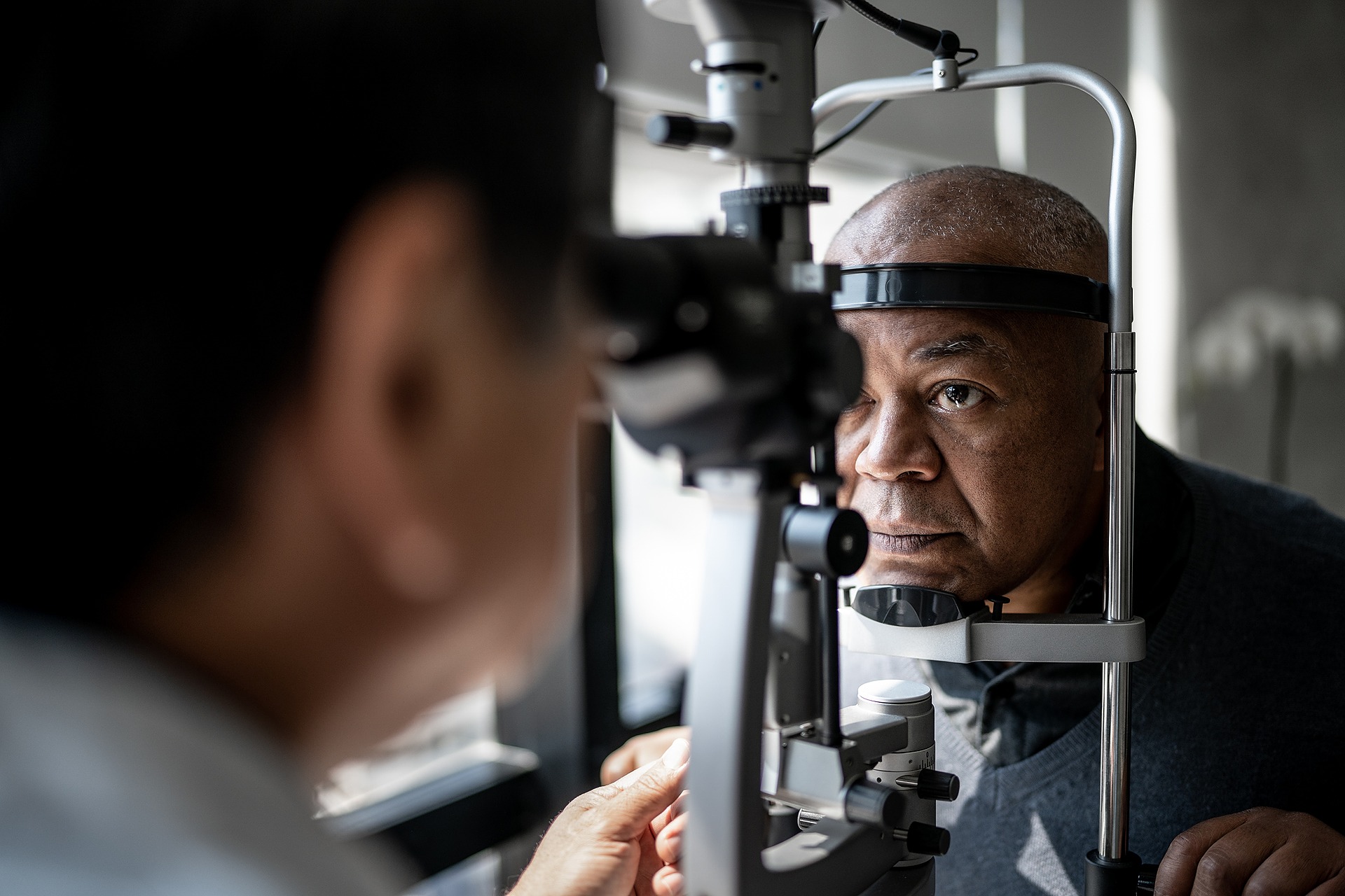 male patient sits for his eye exam