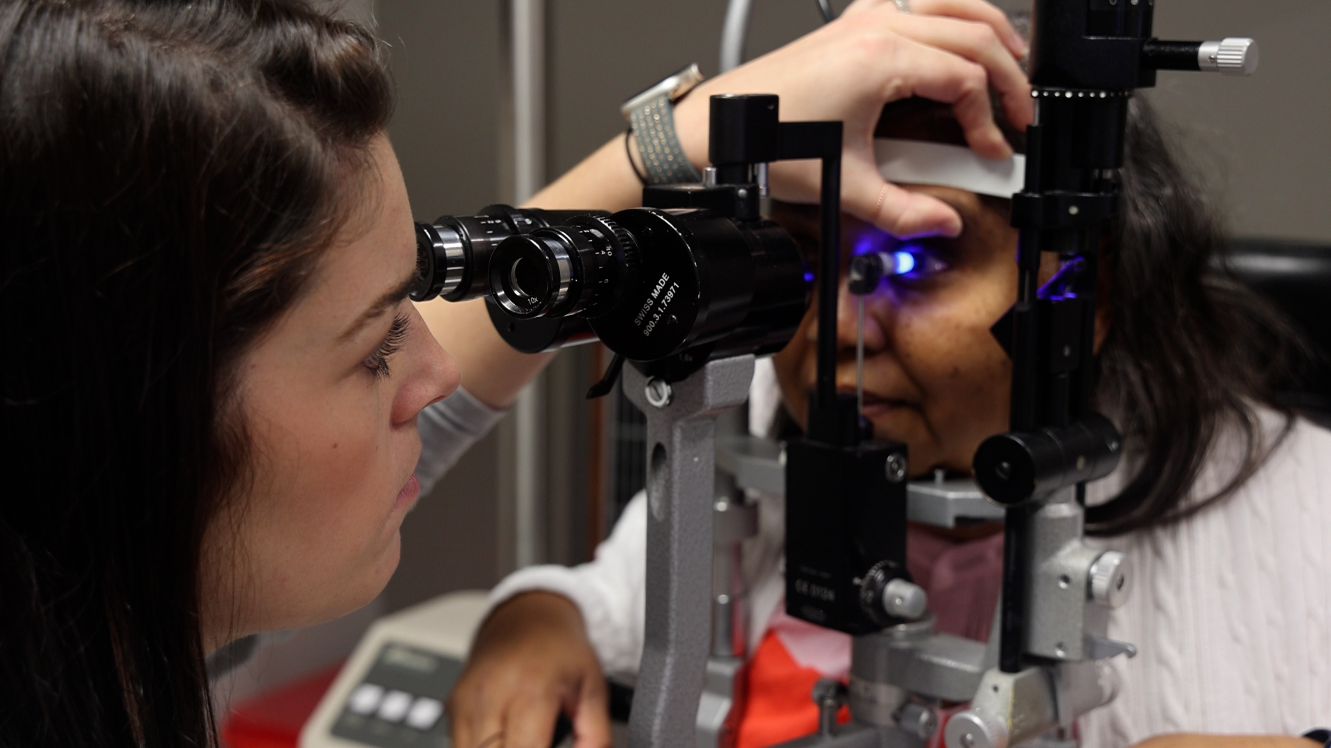 A Vistar employee giving an eye exam to a Vistar patient